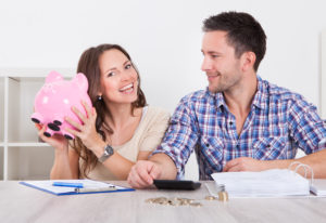couple with piggy bank savings